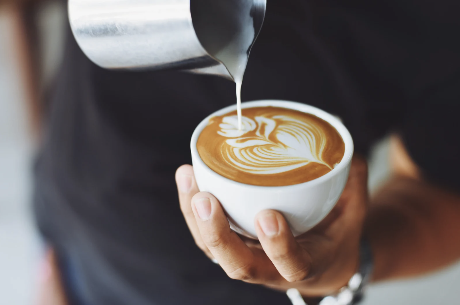 Barista pouring coffee